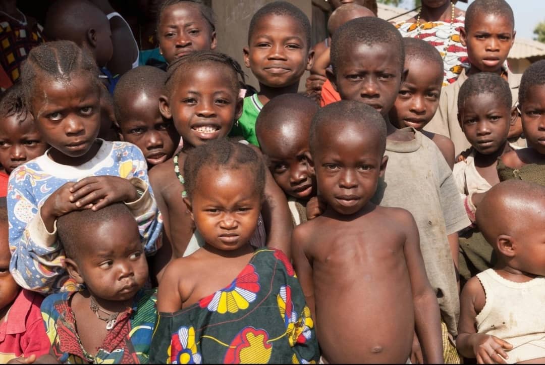 A large group of young children in a Zambian community