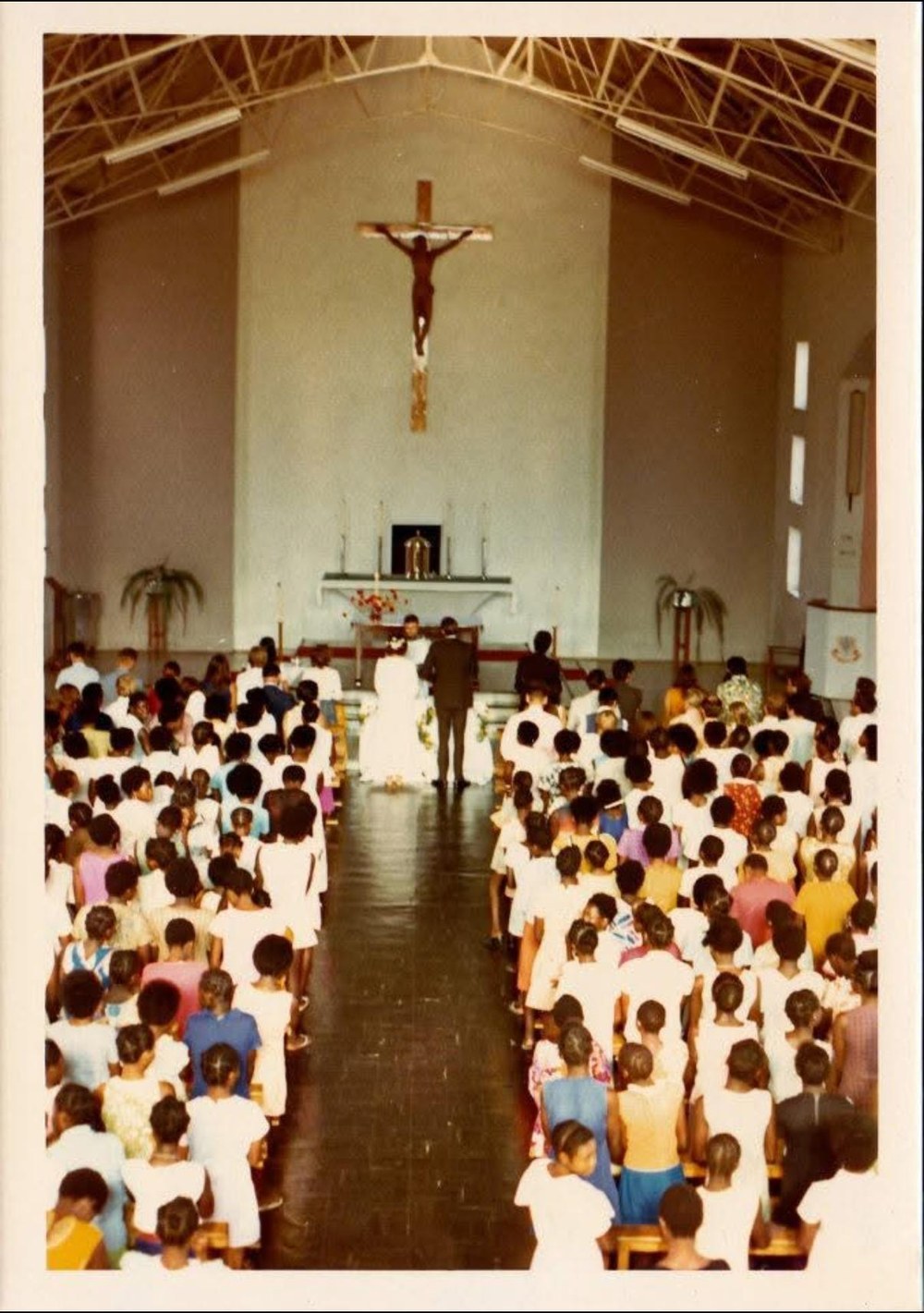 Sue Pujdak's parents' wedding ceremony inside a packed church in Zambia, 1973